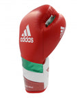 Red boxing glove with white stripes, adidas Adi-Speed 500, for kickboxing.