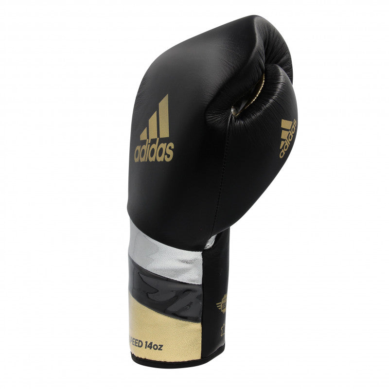 A black and gold boxing glove by adidas, 16 oz, for boxing and kickboxing.