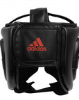 Black headgear with adidas logo for boxing.