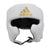 White boxing helmet with gold logo for protection.