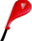 Red Adidas training pad with a black handle on a white background