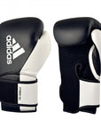 Pair of white and black adidas Hybrid 150 training gloves, 12 oz.