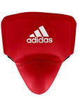 Red boxing pad with white Adidas logo for protection.