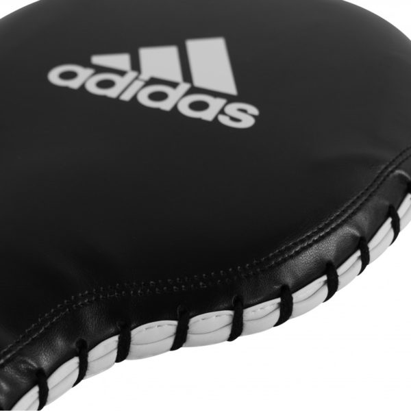 Black and white boxing glove, adidas Boxing Paddle Target equipment.