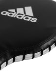 Black and white boxing glove, adidas Boxing Paddle Target equipment.