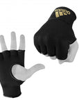 Hand wearing a black glove with gold detail.