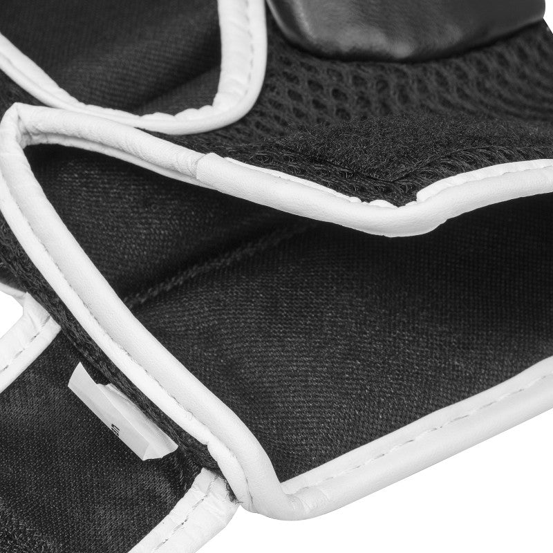 Close-up of a black and white boxing glove for grappling.