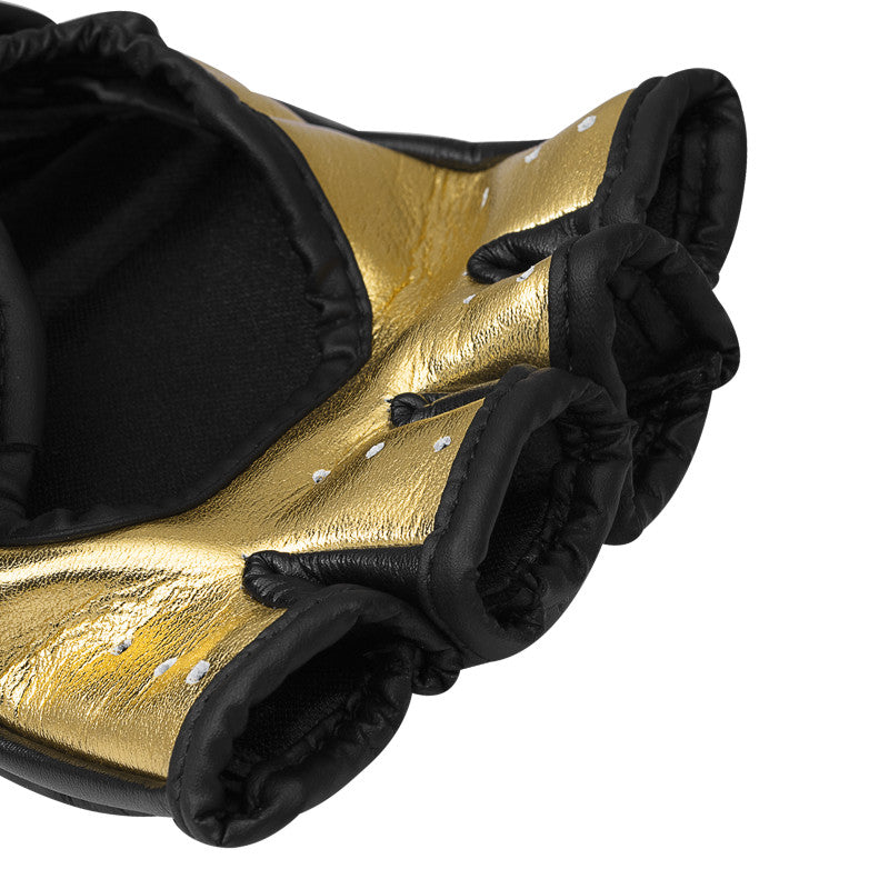 Close-up of GRAPPLING 350 boxing glove in white, gold, black, size S.