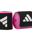 A pair of black and pink wrist wraps for boxing, size 3.5m.