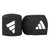 A pair of black wrist wraps for boxing with stretchable tape.