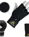 Black glove with a white glove in boxing bundle.