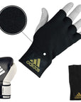 A black glove paired with a white boxing glove.