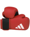 Red boxing gloves with black accents and Adidas logo on a white background
