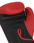 Black boxing glove with red padding on a white background