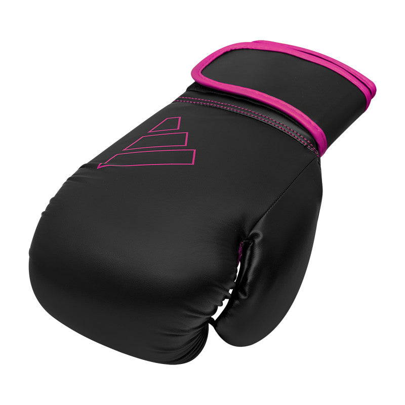 Black and pink Adidas Hybrid 80 boxing glove.