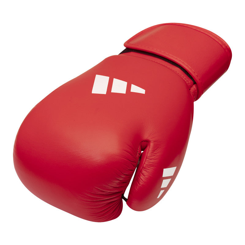 Red Adidas boxing glove with white logo.