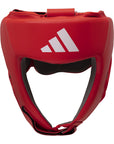 A red boxing helmet with a white logo for competitions.