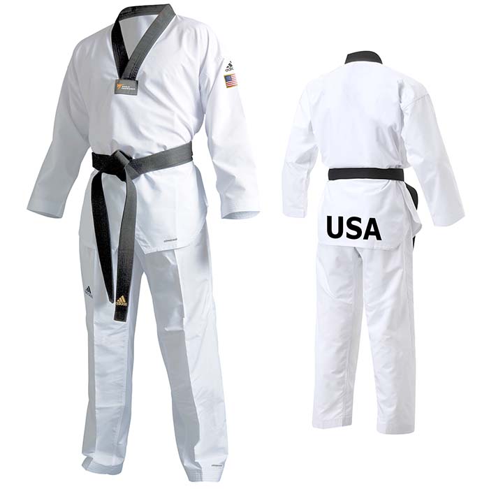 White karate uniform with black belt on display.