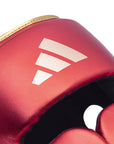 Close up of a boxing glove placed on a flat surface.