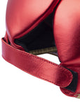 Red boxing helmet with strap designed for protection.