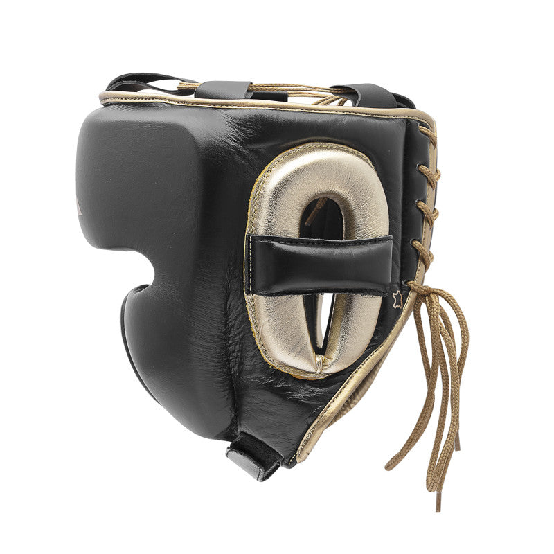 Black and gold boxing mask, part of protective boxing equipment.