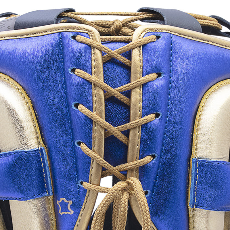 Close-up of a boxing glove on a plain background.