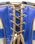 Close-up of a boxing glove on a plain background.