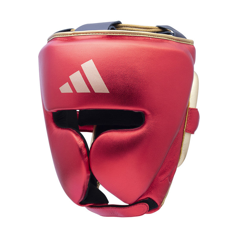 A red boxing helmet with a white logo on the front.