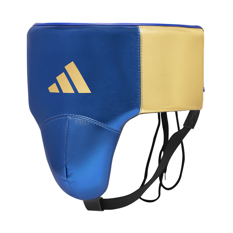 A blue and gold boxing helmet resting on a surface.