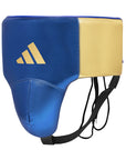 A blue and gold boxing helmet resting on a surface.