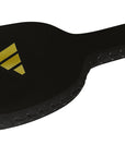 Black paddle with a yellow logo, used in boxing.