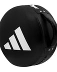 Black and white circular object with white logo.