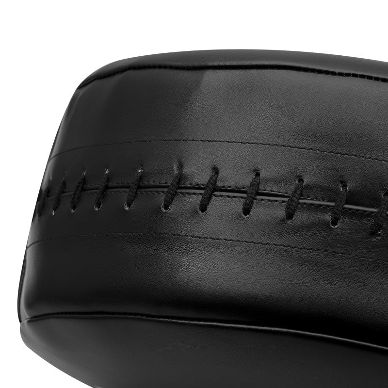 Close-up of a black leather kick ball used in boxing.