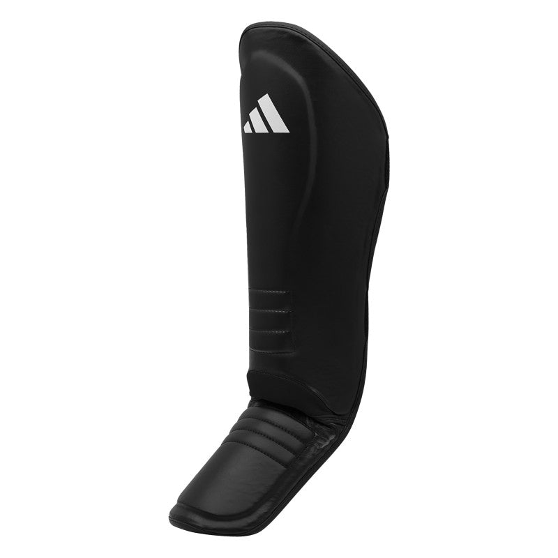 Black shin guard with white logo for Boxing Protective Equipment.