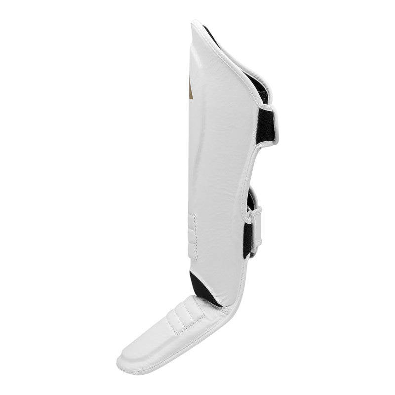 White shin guard with black straps, medium size for boxing.