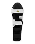 Black and white leg guard for boxing equipment.