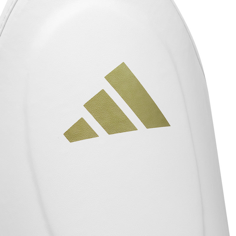 A close-up of a white boxing protective gear.