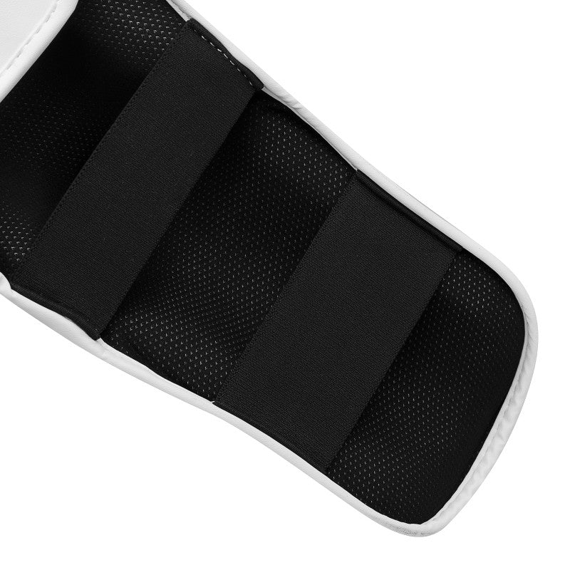 Close-up of a white and black pad used in boxing protection.