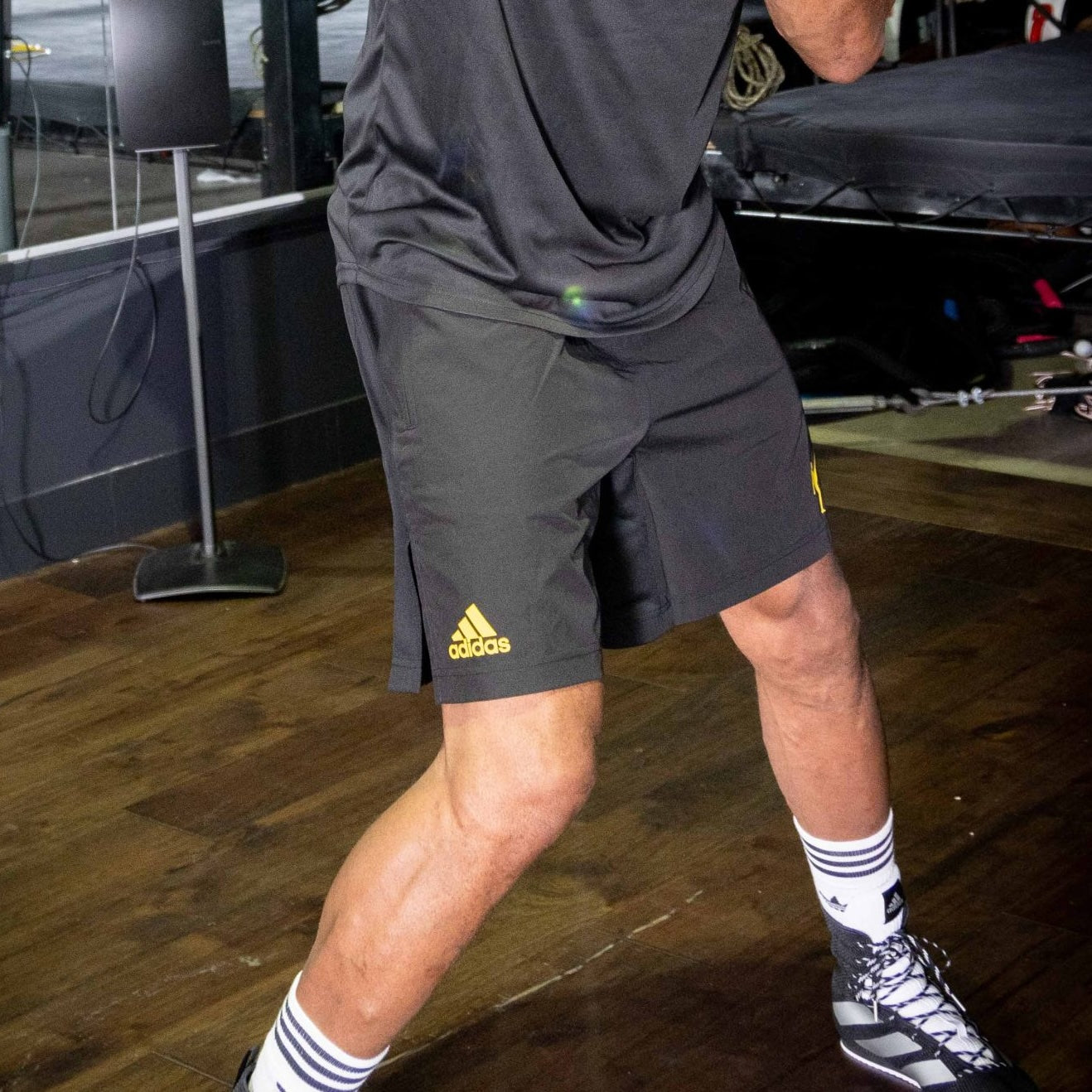 A man wearing black shorts and socks.