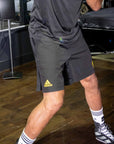 A man wearing black shorts and socks.