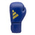 Blue boxing glove featuring a gold logo emblem.