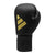 A black boxing glove with gold logo.