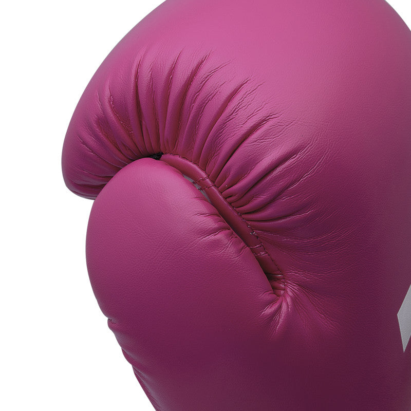 Close up of pink boxing glove for training.