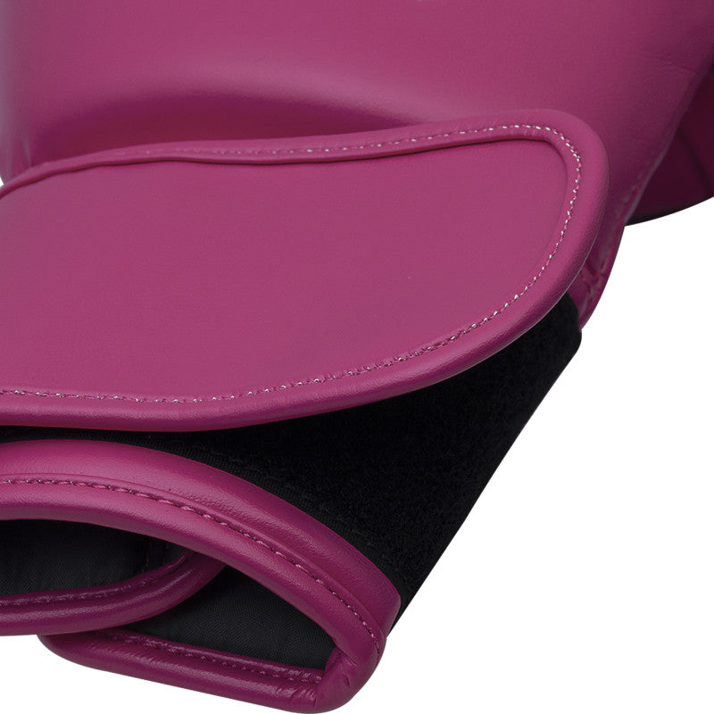 Close up of pink boxing glove for training.