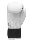 White boxing glove with black straps displayed against a neutral background.