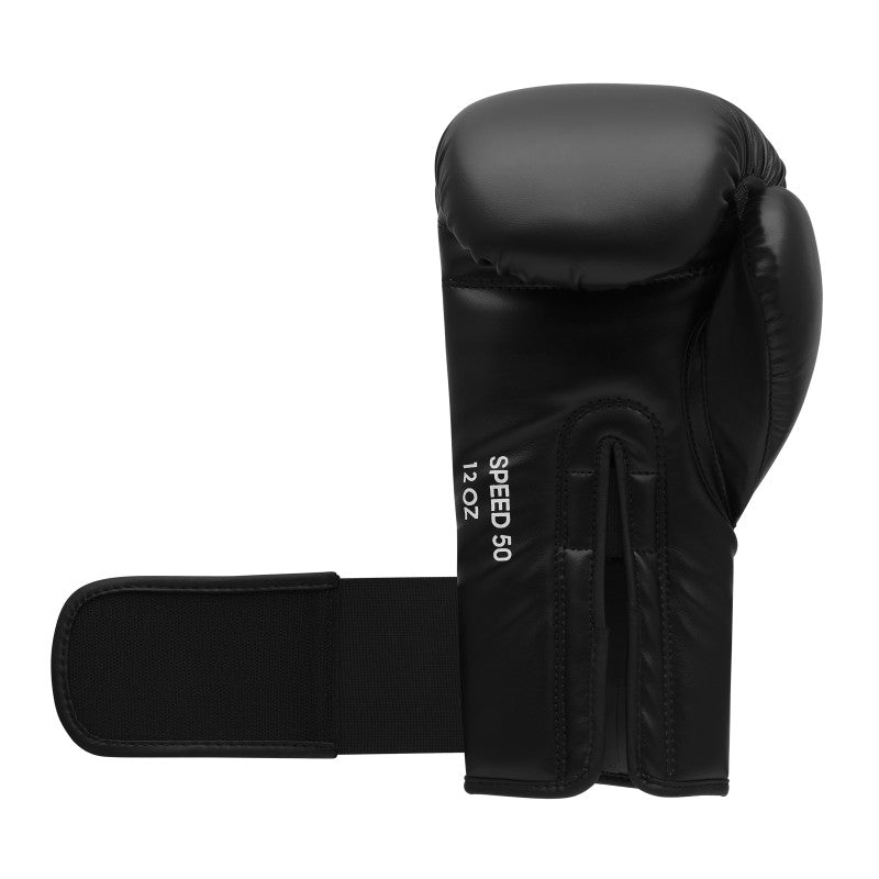 A black boxing glove with a black strap.