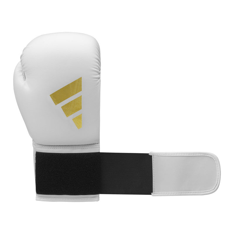 White boxing glove with black straps displayed against a neutral background.