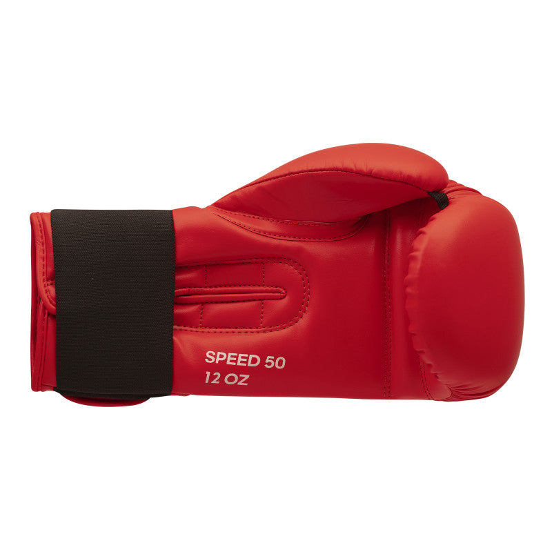 Red boxing glove with black trim, designed for enhanced performance.