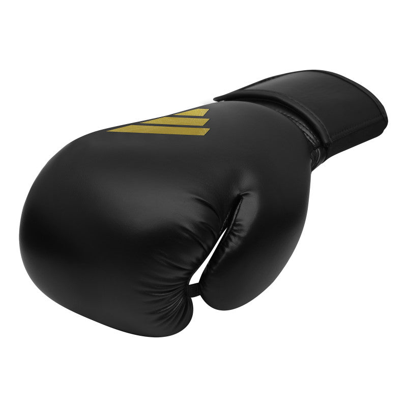 Black boxing glove with yellow stripes, adidas boxing gear.