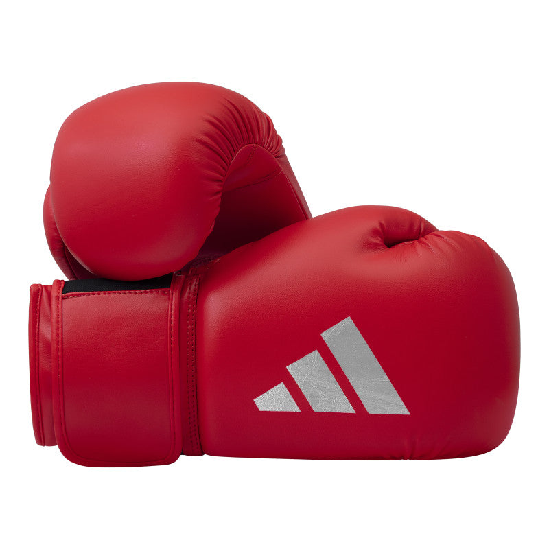 Pair of red boxing gloves displayed.